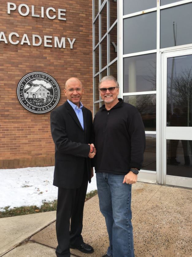 Capt. SanAntonio is congratulated by FBI-LEEDA instructor Les Kachurek